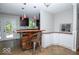 An open kitchen boasts custom wood accents, granite countertops, and stainless steel appliances at 4023 Cedar Hills South Dr, Greenwood, IN 46143