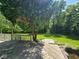 Backyard features a huge lawn and wooden deck with an elevated view of the property at 4115 Tansel Rd, Indianapolis, IN 46234