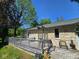 The backyard features a large porch area overlooking a luscious, green lawn at 4115 Tansel Rd, Indianapolis, IN 46234