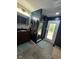 This gorgeous bathroom features an eye-catching dark marble shower and a door with backyard access at 4115 Tansel Rd, Indianapolis, IN 46234