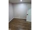Cozy bedroom with wood-look flooring and neutral walls at 4115 Tansel Rd, Indianapolis, IN 46234