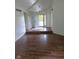 Bright entryway featuring wood-look floors and a welcoming front door at 4115 Tansel Rd, Indianapolis, IN 46234