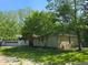 Charming single-story home with a well-manicured lawn and mature trees at 4115 Tansel Rd, Indianapolis, IN 46234
