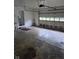 A large, open garage with door at 4115 Tansel Rd, Indianapolis, IN 46234