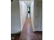 Long, bright hallway with wood-look flooring and white trim at 4115 Tansel Rd, Indianapolis, IN 46234