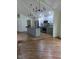 Modern kitchen with stainless steel appliances, white cabinets and a gray island at 4115 Tansel Rd, Indianapolis, IN 46234