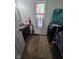 Laundry room with washer and dryer, and hardwood flooring with a window providing natural light at 4115 Tansel Rd, Indianapolis, IN 46234
