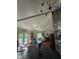 Open living area showcasing a dining table, a stone fireplace, and an adjoining living room at 4115 Tansel Rd, Indianapolis, IN 46234