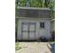 Charming shed with double doors and a classic window provides ample storage for outdoor essentials at 4115 Tansel Rd, Indianapolis, IN 46234