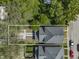An aerial view showcases a charming house with a newly installed gray roof at 418 Harlan St, Indianapolis, IN 46201