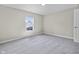 Bright bedroom with window, neutral walls, carpet, and modern fixtures at 418 Harlan St, Indianapolis, IN 46201