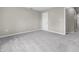 A bright bedroom featuring neutral walls, gray carpet, and white trim at 418 Harlan St, Indianapolis, IN 46201