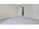 Large bedroom with neutral paint and plush carpet at 418 Harlan St, Indianapolis, IN 46201