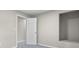 Bedroom featuring neutral paint, carpet, and trim; an open interior, and modern doors at 418 Harlan St, Indianapolis, IN 46201