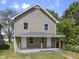 Two-story home featuring a covered front porch at 418 Harlan St, Indianapolis, IN 46201
