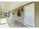 Inviting front entrance with covered porch, tan siding, and clear windows at 418 Harlan St, Indianapolis, IN 46201