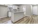 Updated kitchen featuring white cabinets, granite countertops, and a central island at 418 Harlan St, Indianapolis, IN 46201