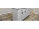Kitchen island with granite countertops and white cabinets and black hardware at 418 Harlan St, Indianapolis, IN 46201