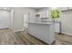 Kitchen with granite countertops, white cabinets, and stainless faucet at 418 Harlan St, Indianapolis, IN 46201