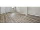 Open living room space features a front door and modern floors at 418 Harlan St, Indianapolis, IN 46201