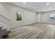 Open-concept living room boasts with great natural light and modern floors at 418 Harlan St, Indianapolis, IN 46201