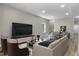 Comfortable living room area with a large TV, modern furniture, and stylish decor at 418 Harlan St, Indianapolis, IN 46201