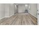 Open living room features great natural light, stairs and hard wood floors at 418 Harlan St, Indianapolis, IN 46201