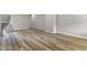 Comfortable living room with hardwood floors, stairway, and neutral paint ready for furnishings at 418 Harlan St, Indianapolis, IN 46201
