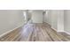 Spacious living room features wood flooring, fresh paint, and a staircase to upper level at 418 Harlan St, Indianapolis, IN 46201