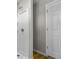 A bathroom featuring a stand up shower with white walls and a white door at 418 Harlan St, Indianapolis, IN 46201
