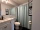 Cozy bathroom features a toilet, tub/shower combo, vanity and towel storage at 5117 Bahia Dr, Indianapolis, IN 46237
