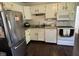 Classic kitchen with white cabinetry and stainless steel appliances at 5117 Bahia Dr, Indianapolis, IN 46237