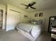 Spacious main bedroom featuring carpet flooring, ceiling fan and white closet doors at 5117 Bahia Dr, Indianapolis, IN 46237