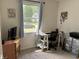 A practical home office area with a desk, rolling drawers, and natural light at 5117 Bahia Dr, Indianapolis, IN 46237