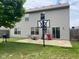 Backyard featuring a patio, basketball hoop, grill, and sliding glass doors at 5241 Waterton Lakes Dr, Indianapolis, IN 46237