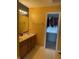 Bathroom with a double vanity and a walk-in closet at 5241 Waterton Lakes Dr, Indianapolis, IN 46237