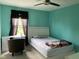 Bedroom features light walls, dark curtains, desk, chair, and natural light at 5241 Waterton Lakes Dr, Indianapolis, IN 46237