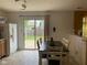 Eat-in kitchen features a sliding glass door leading to a spacious backyard with a privacy fence at 5241 Waterton Lakes Dr, Indianapolis, IN 46237