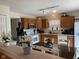 Bright kitchen featuring wood cabinets and updated appliances at 5241 Waterton Lakes Dr, Indianapolis, IN 46237