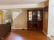 Elegant living room with a decorative china cabinet and hardwood flooring at 5241 Waterton Lakes Dr, Indianapolis, IN 46237