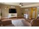 Spacious living area with hardwood flooring, ceiling fan and decor at 5241 Waterton Lakes Dr, Indianapolis, IN 46237