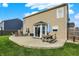 Backyard view showcasing the patio, outdoor seating, and well-maintained lawn at 5517 Jona Way, Bargersville, IN 46106