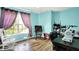 Bright bedroom with hard wood floors features a sunny window and sewing machine setup at 5517 Jona Way, Bargersville, IN 46106