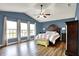 Spacious bedroom features a ceiling fan, hardwood floors, and bright natural light at 5517 Jona Way, Bargersville, IN 46106
