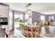 Sun-filled dining room boasts hardwood floors and a sliding door for outdoor access at 5517 Jona Way, Bargersville, IN 46106