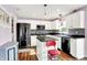 Well-equipped kitchen features stainless steel appliances, white cabinetry, and tiled backsplash at 5517 Jona Way, Bargersville, IN 46106