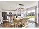 Bright kitchen features modern appliances, an island and flows into a dining area at 5517 Jona Way, Bargersville, IN 46106