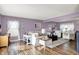 Spacious living room features hardwood floors, providing a cozy atmosphere with lots of natural light at 5517 Jona Way, Bargersville, IN 46106