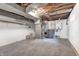 Unfinished basement with concrete floor, painted walls, exposed utilities providing ample storage space at 5809 N Illinois St, Indianapolis, IN 46208