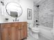 Modern bathroom features a wood vanity, decorative mirror, and tiled shower at 5809 N Illinois St, Indianapolis, IN 46208